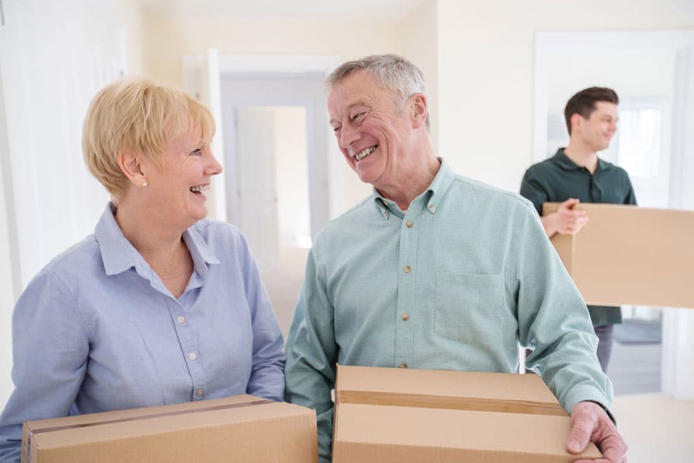 Senior couple with moving boxes